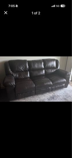Leather reclining couch with center foldout.