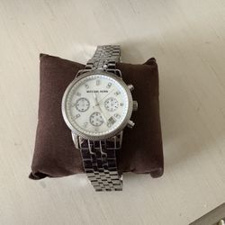 Women’s Michael Kors chronograph with a stainless steel bracelet and a mother-of-pearl dial