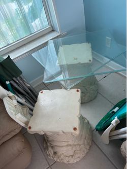 2 dolphin tables with glass tops