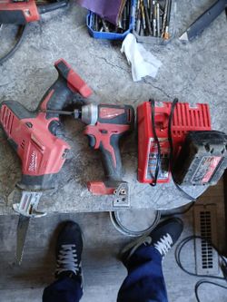 Milwaukee 18v impact drill with heavy duty handheld sawsall  plus one 18v battery and charger
