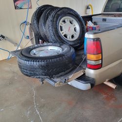 265/75/r16 Tires And GMC Rims With Lugs And Caps