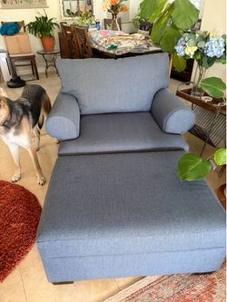 Blue-gray chair and ottoman for sale.