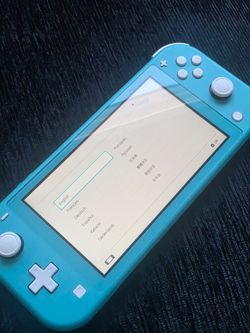 Nintendo Switch Lite Handheld Console-Turquoise excellent condition with charger