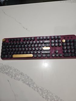 Burgundy keyboard with mouse.