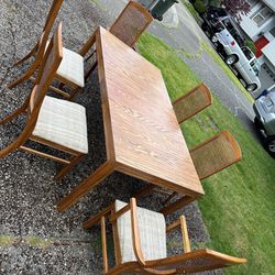 Dining table and 6 wicker chairs 