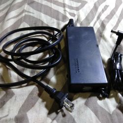 Universal Lab Top Charger With Two USB Ports Built-in On The End And A Selector Switch So You Can Change The Voltage Output