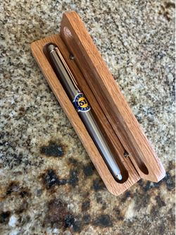 Retro 51 branded pen in a wooden Motorola-branded display case