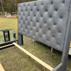 King size bed 5 feet 67 inches tall headboard with silver pendants running down the headboard