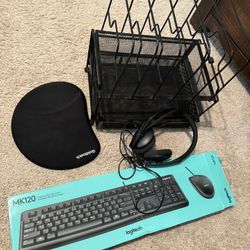 Mouse, keyboard, paper organizer, headphones, and mouse pad