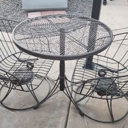 Vintage Wrought t Iron BISTRO table  and Chairs.