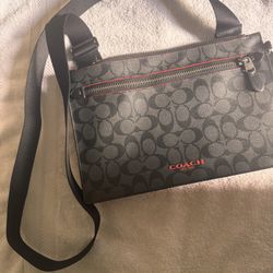Men’s Coach signature canvas crossbody or messenger bag with red accents