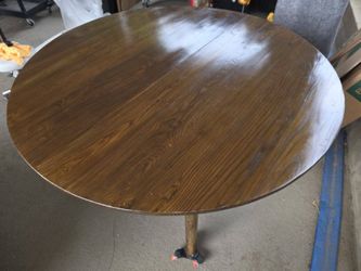 Round brown wood dining table