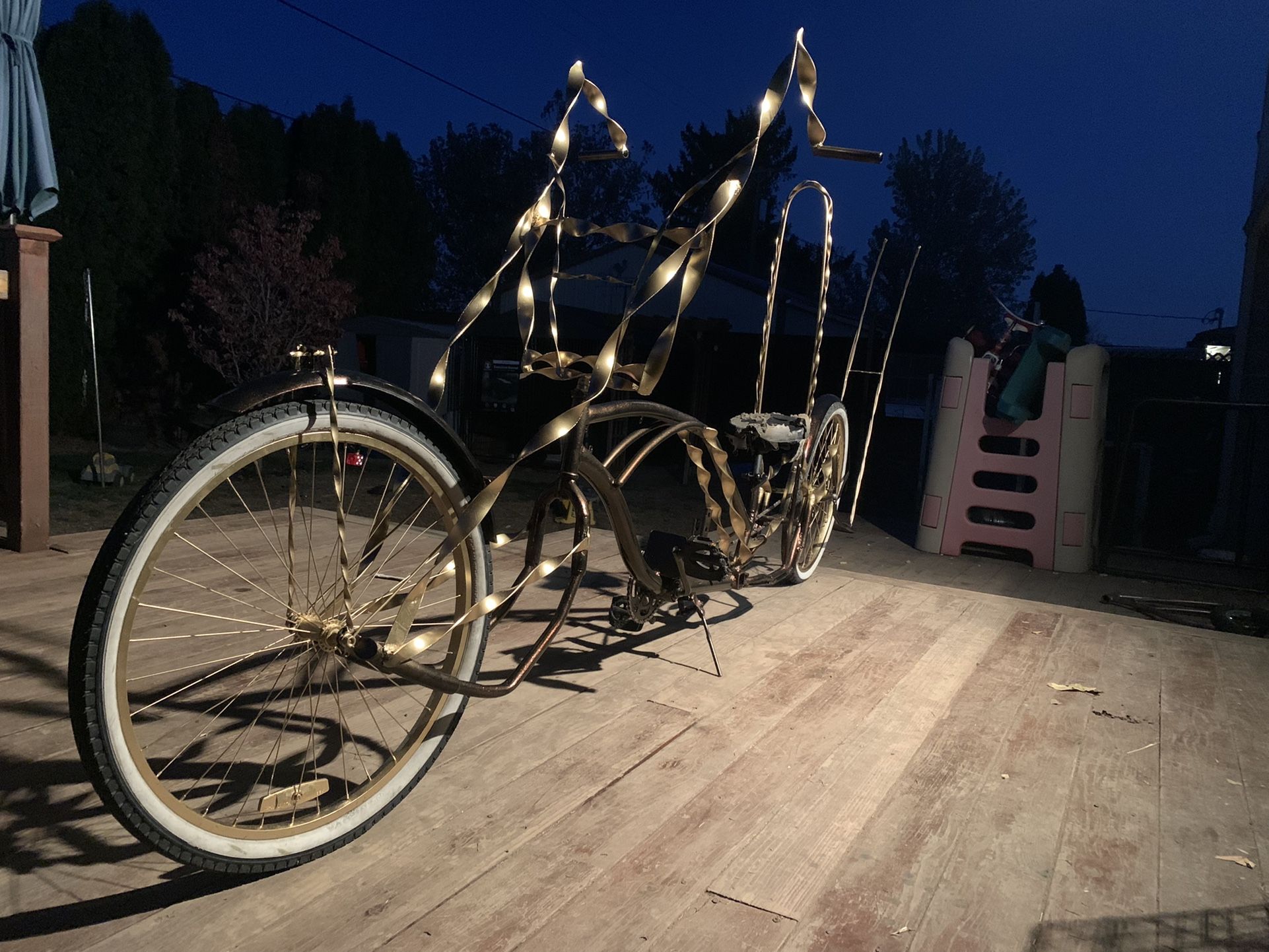 Red excusable and gold lowrider bike