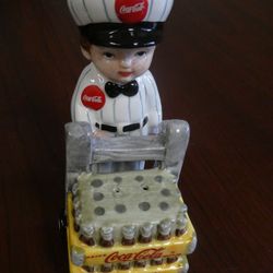 Vintage 2 Coca Cola Items 1 Porcelain Delivery Man W/Cart And 1 Gas Pump Style Both Salt And Pepper Shakers Like New Located In Palm Springs CA 
