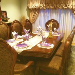 Traditional Dining Table With Eight Chairs And A Buffet With Mirror