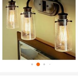 KICHLER
(Brand 
Braelyn 24 in. 3-Light Old Bronze Vintage Bathroom Vanity Light with S