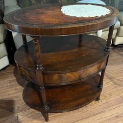 Antique Oval end table leather top early 20th century.