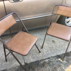 Two nice cushion fold up chairs Only $30 firm