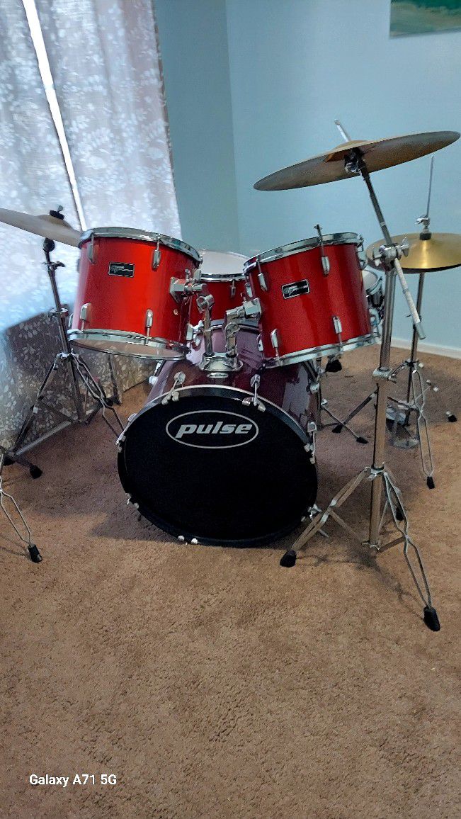 Pulse And Precision drum set with symbols.