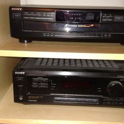 CD player with amplifier and two speakers.