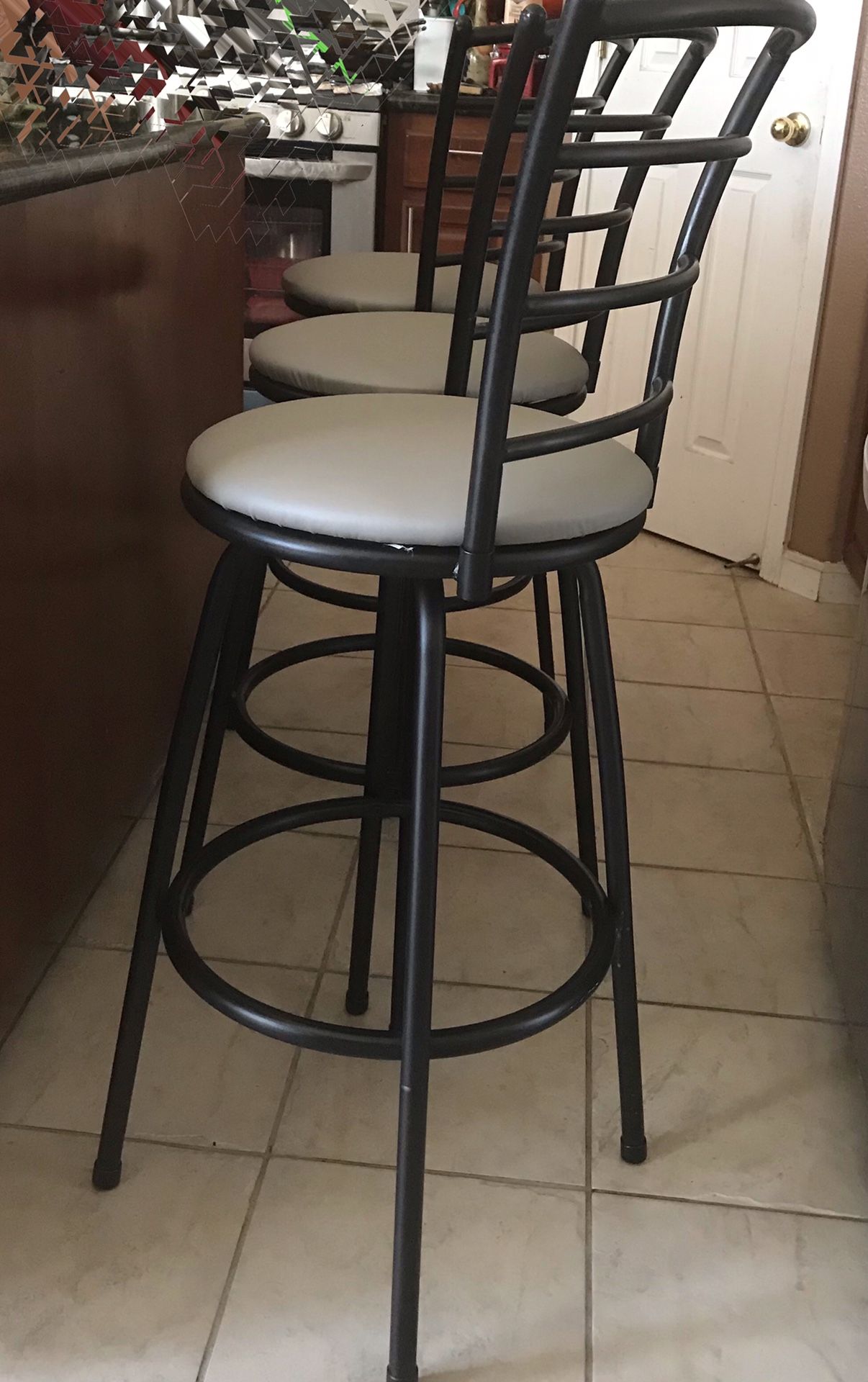 3 gray and black swivel bar stools
