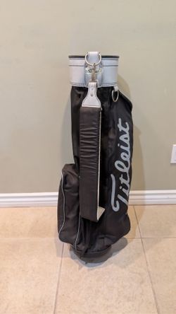 USED TITLEIST ULTRA LITE GOLF CARRY BAG is BLACK/ WHITE STRIPER