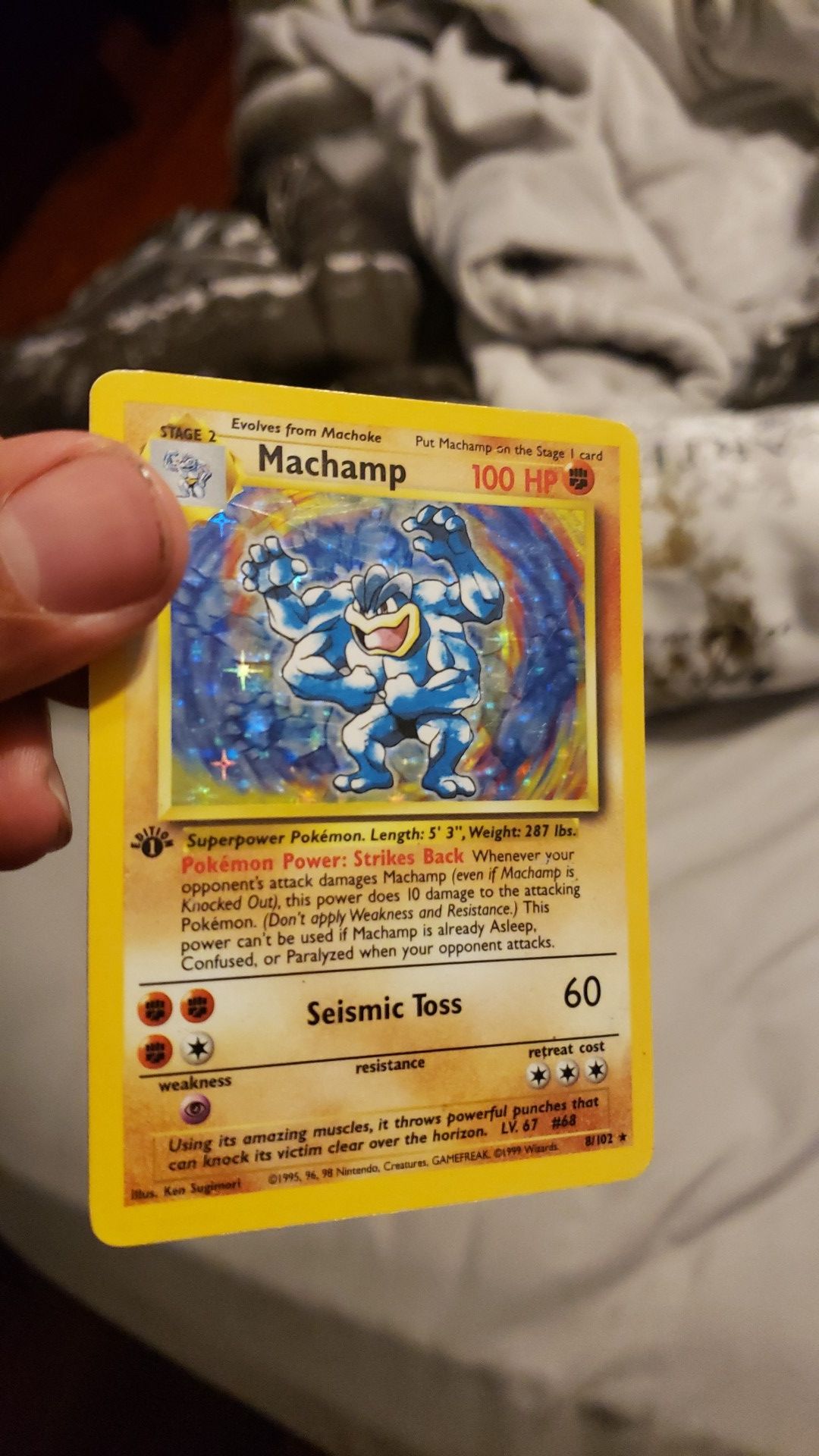 1st edition Machamp card 8/102 (holo)