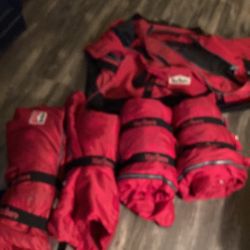 Four sleeping bags and bag