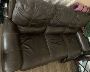 Dual electric, reclining leather couch