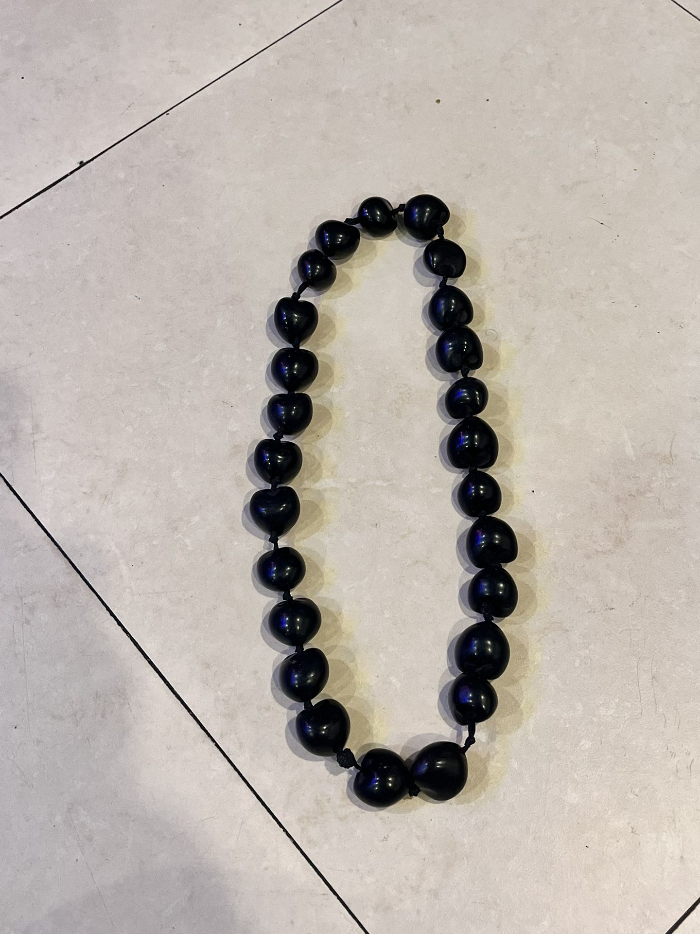 Hawaiian Lei Necklace of Black Kukui Nuts Individually Knotted.