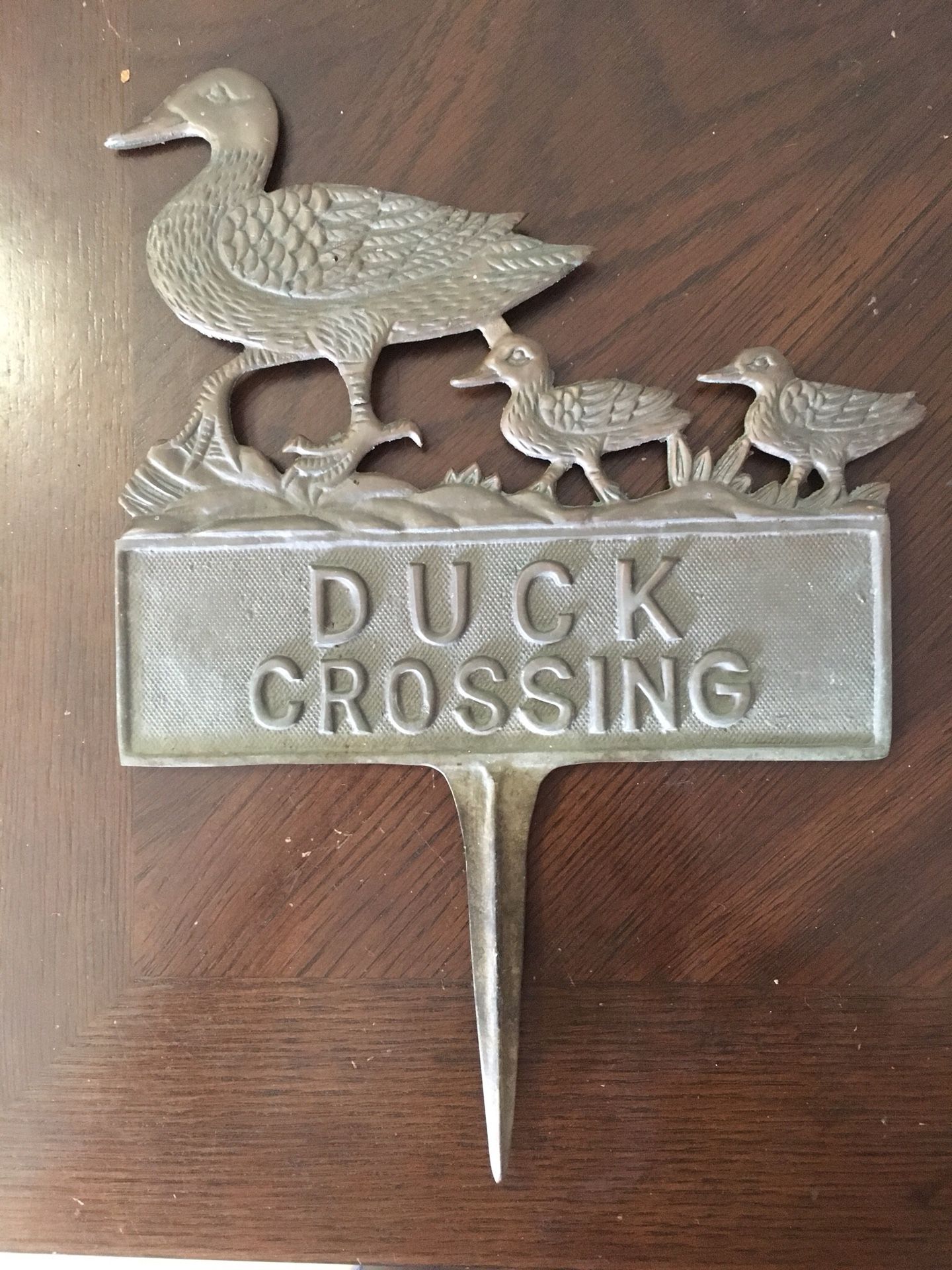 Vintage bronze ducks crossing sign