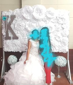 Tissue paper flower backdrop on wooden stand