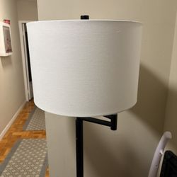 Adjustable Black Floor Lamp with White Shade with a great condition and attractive price