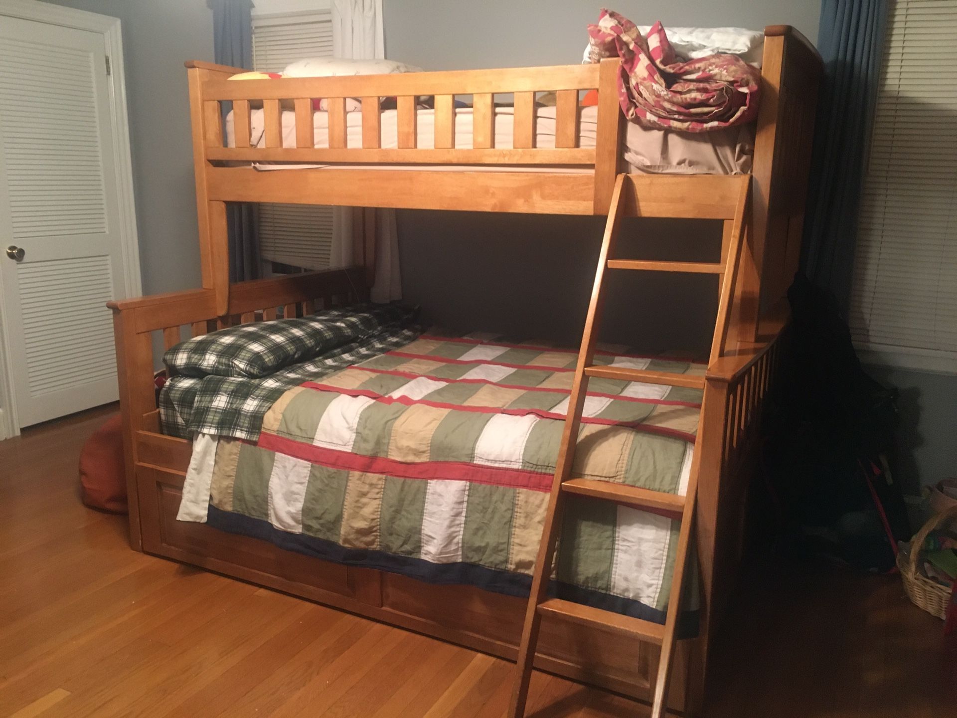 Twin over Full bunk bed w/ a trundle bed. New mattresses included.