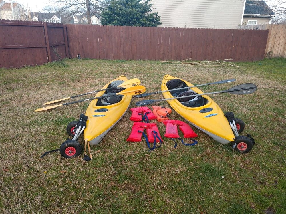 2 Pelican Pursuit 140T Tandem kayak's w/ paddles & wheels $350