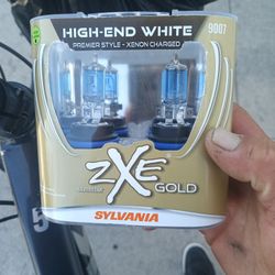 Sylvania ZXE GOLD 9007 Headlight Bulbs. BrNd New