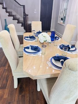 Marble dining table with 6 cloth swivel chairs