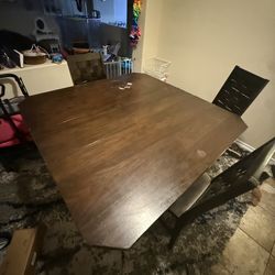 Solid wood table with three chairs… Counter height