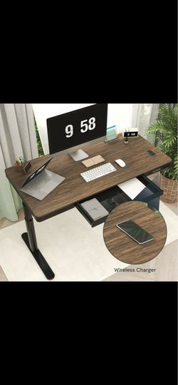 Standing desk with wireless charging and free monitor arm