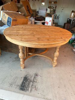 Round wooden table with leaf extension
