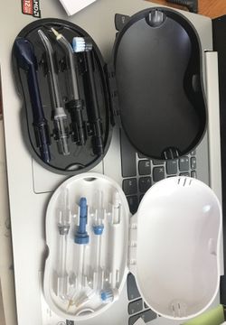 New Waterpik brushes, tips sets in carrying cases