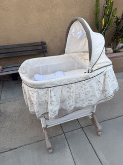 Delta Children Rocking Bedside Bassinet - Portable Crib with Lights Sounds and Vibrations, Play Time Jungle