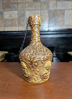 Vintage Spanish hand-tooled leather-wrapped liquor or whiskey decanter