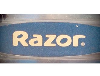 RAZOR SCOOTER WITH BLUE HANDLES, LIGHTWEIGHT AND FOLDABLE. LOOKS LIKE NEW!