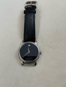 Movado Museum model watch, identifiable by the MO.01.1.14.6000 product code engraved on the back.