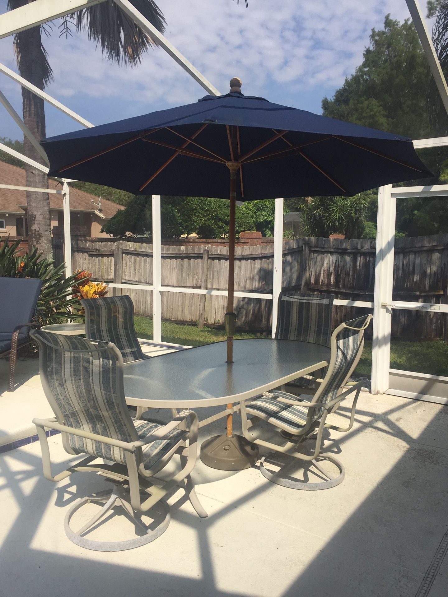 Leaders casual patio furniture. Table w/umbrella and 4 chairs