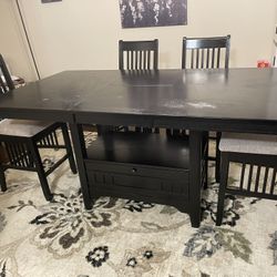 Dining room bar height table with 6 chairs and buffet server