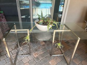 Glass dining table with chrome legs