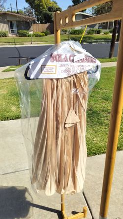 pleated, nude-colored chiffon maxi dress