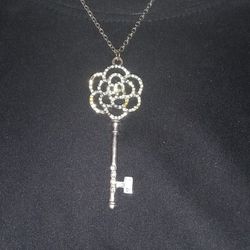 Long Silver Tone Chain With Key Pendant